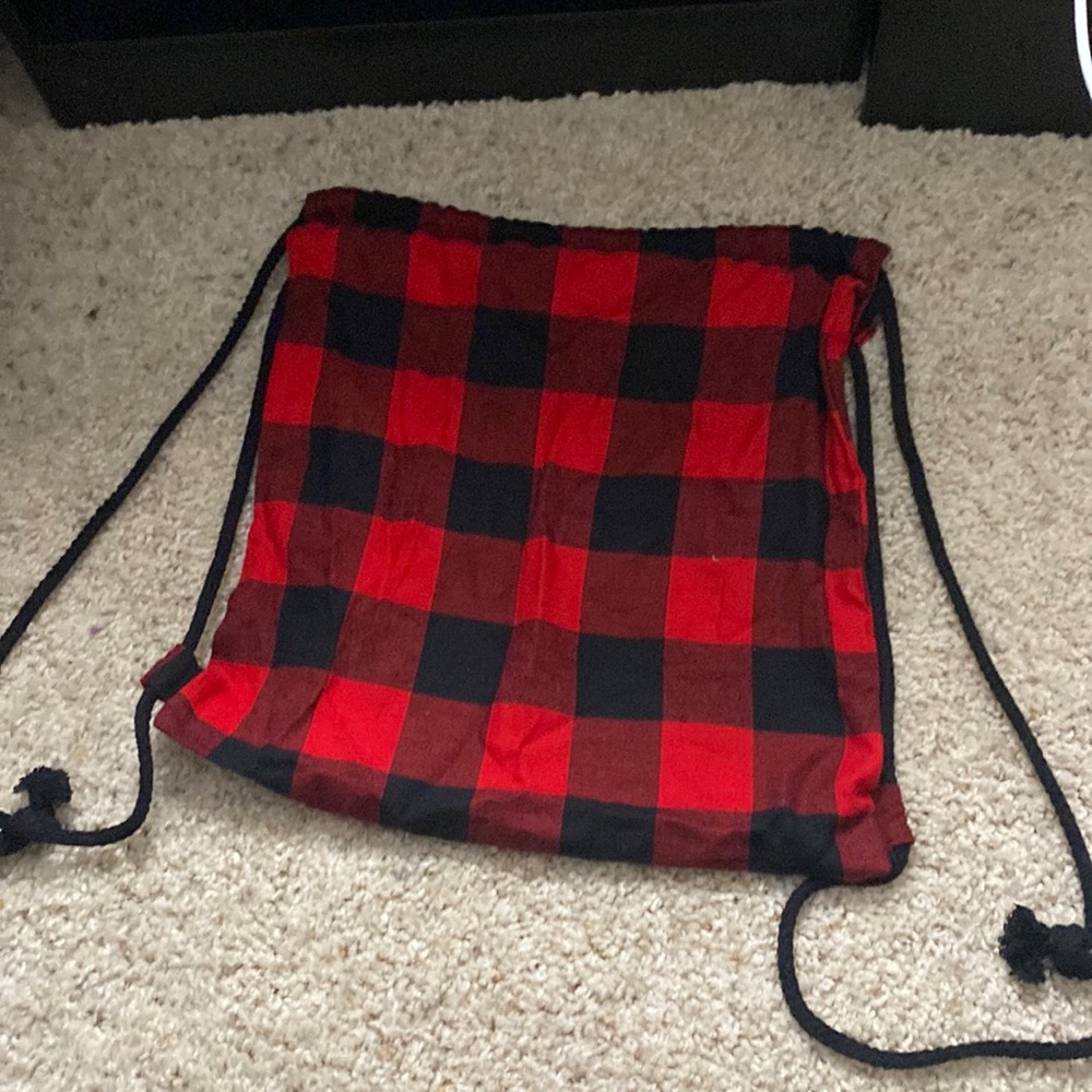 black and red plaid, jaw string bag.